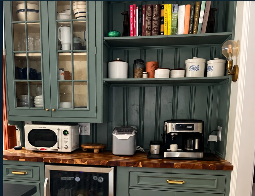 Custom coffee bar with contrasting cabinetry and butcherblock countertop