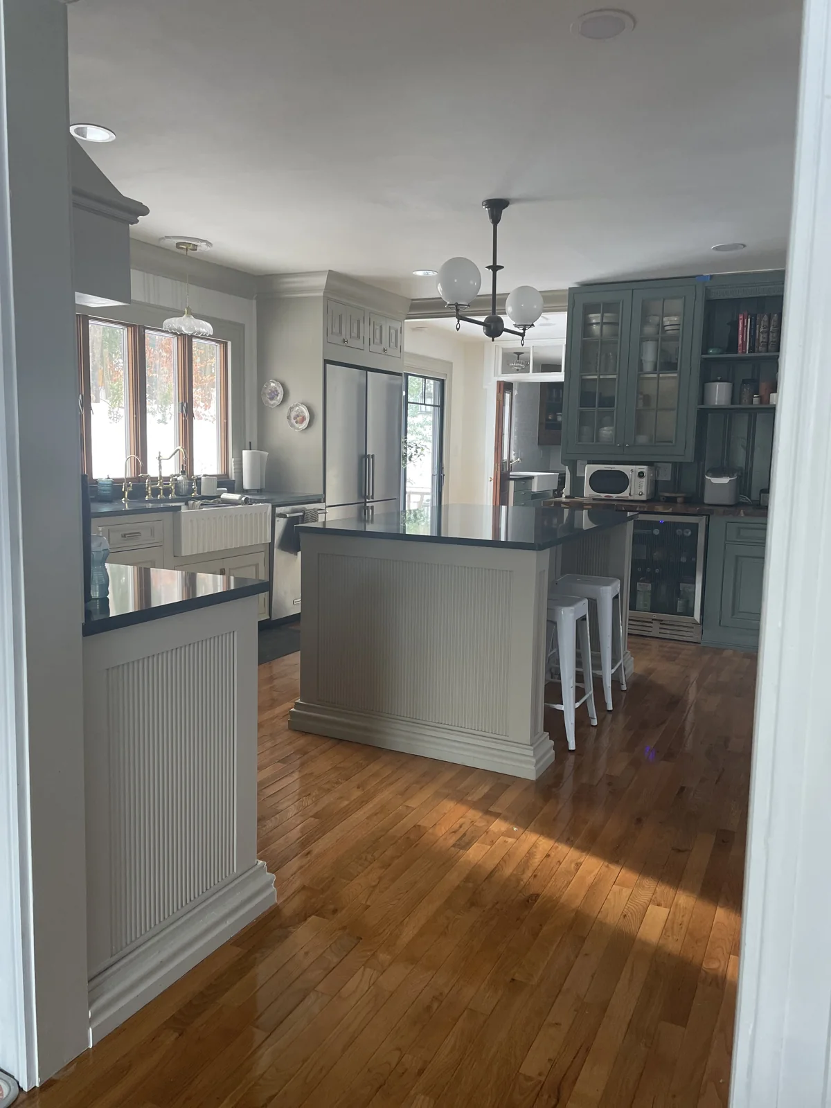 Completed kitchen with distinctive cabinetry, architectural trim and custom details