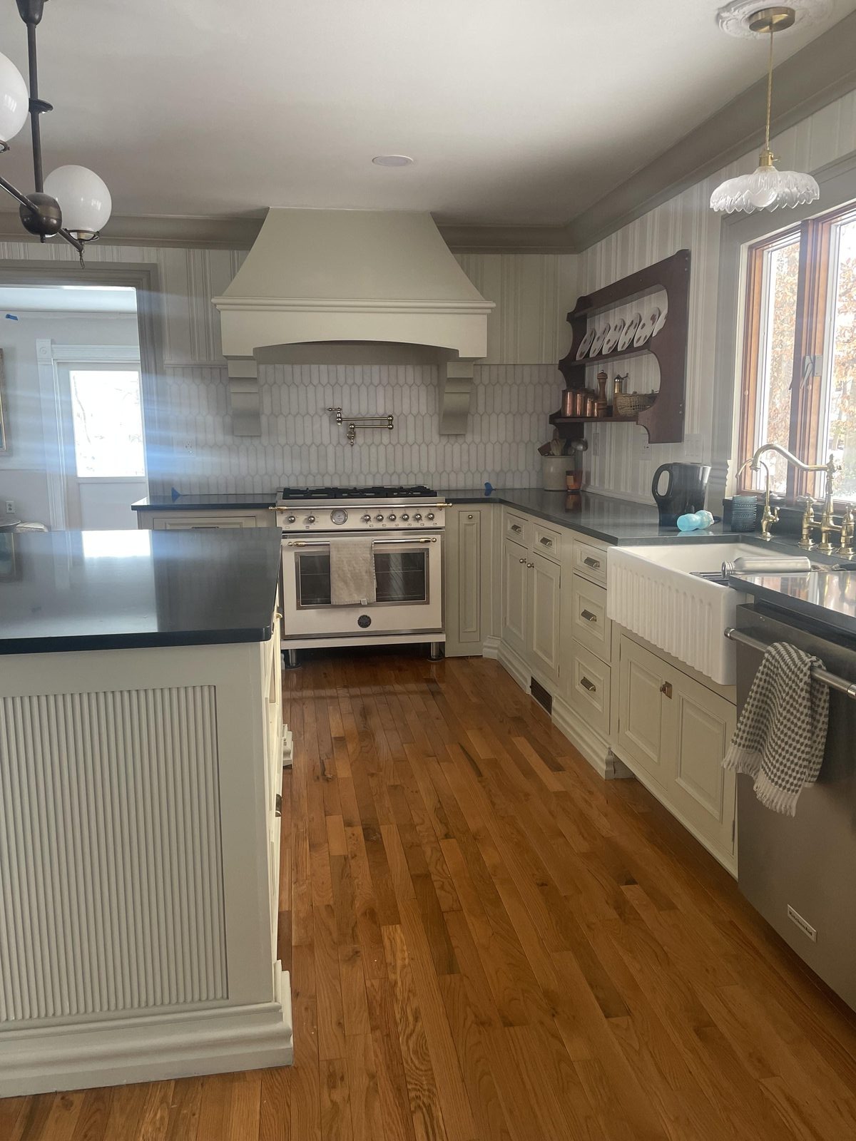 Completed kitchen with custom island and architectural trim